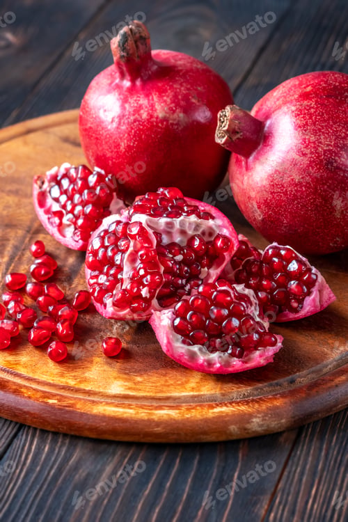 Preview: Fresh pomegranates on the wooden table