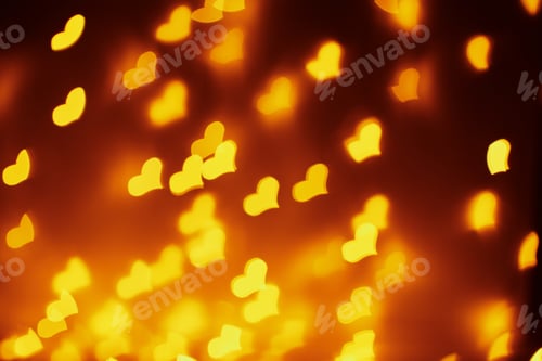 Preview: Abstract background with a golden blurred lights in heart shape. Valentine day concept