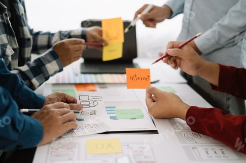 Preview: Creative male web designer planning application development for web mobile phone