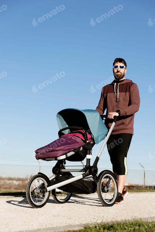 Preview: Father and son walking in the park.