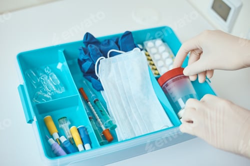 Preview: Hands in medical gloves take test cup from medicine box