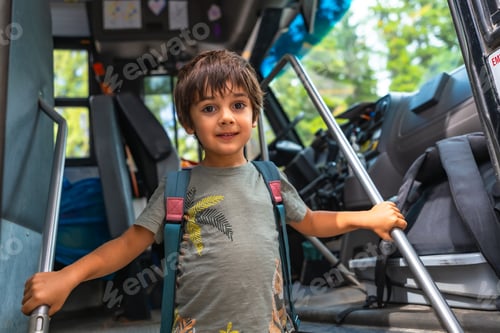 Preview: Preschooler entering school bus holding handrail, back to school