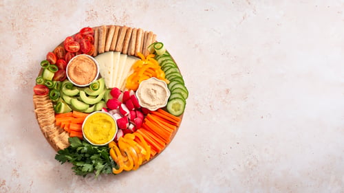 Preview: Colorful vegan Charcuterie board with raw vegetables and whole wheat snacks