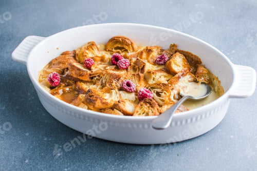Preview: Croissant bread pudding with custard creamy sauce and vanilla ice cream very delicious dessert
