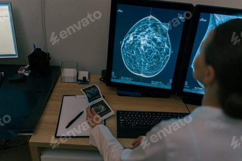 Preview: Back view of professional doctor radiologist analyzing scan MRI images in medical center