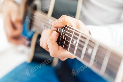 Preview: Man with acoustic guitar, close up