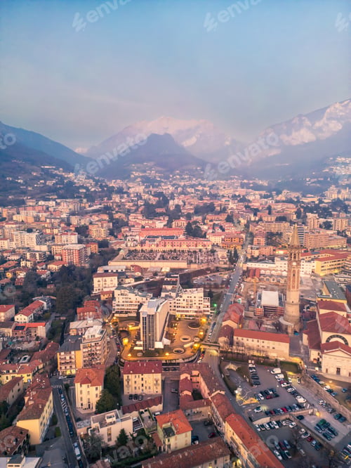 Preview: Aerial of the city of Lecco, Italy, at dusk. Mount Barro in the background