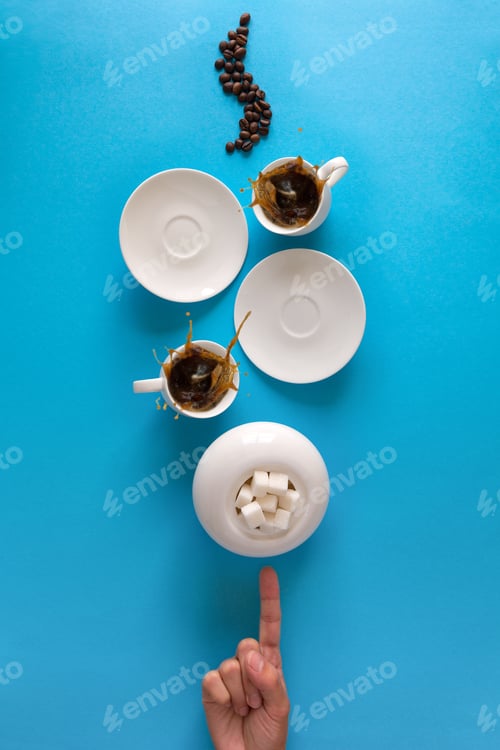 Preview: Hand indicating on cups with espresso splash