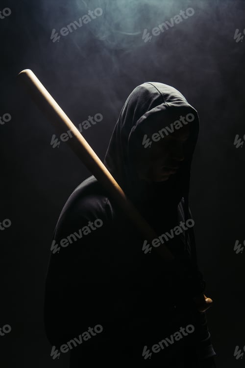 Preview: Silhouette of bandit holding baseball bat on black background with smoke