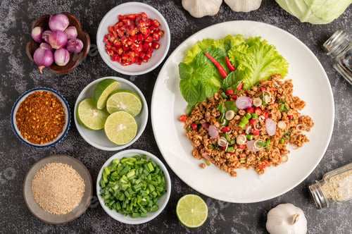 Preview: Spicy minced pork salad with chili flakes, lime, chopped green onions, chilli and roasted rice.
