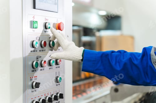 Preview: paper cardboard manufacture factory concept, industry worker person working with recycling machine