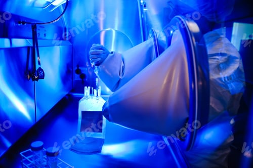 Preview: Scientist working in protected chamber