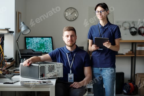 Preview: Team of two young successful engineers