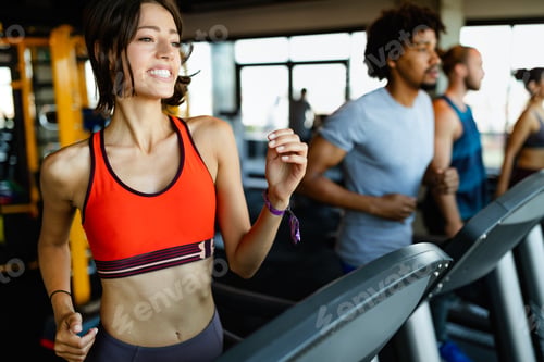Preview: Close up image of attractive fit woman in gym