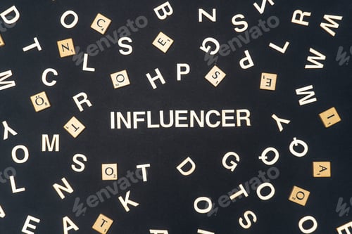 Preview: INFLUENCER word written on dark paper background. INFLUENCER text for your concepts