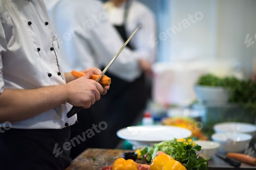 Preview: chef hands cutting carrots