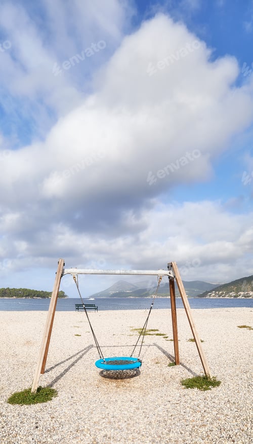 Preview: Swing on a rocky beach.