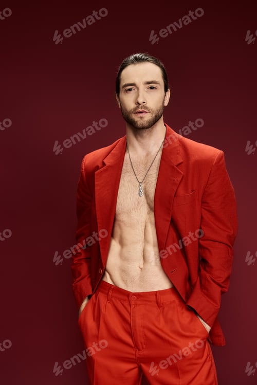 Preview: The dapper gent: stylish man in red suit strikes a pose