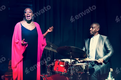 Preview: Drummer and singer performing in an event