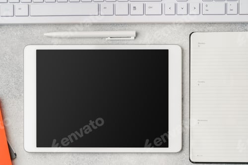 Preview: Digital tablet with empty screen on table with business accessories