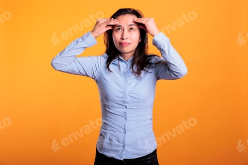 Preview: Confused asian woman brainstorming business ideas