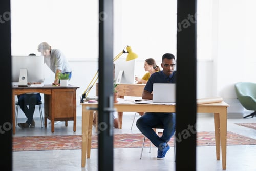 Preview: Perfect work environment. Shot of young professionals working in an office.