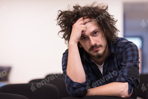 Preview: A student sits alone in a classroom
