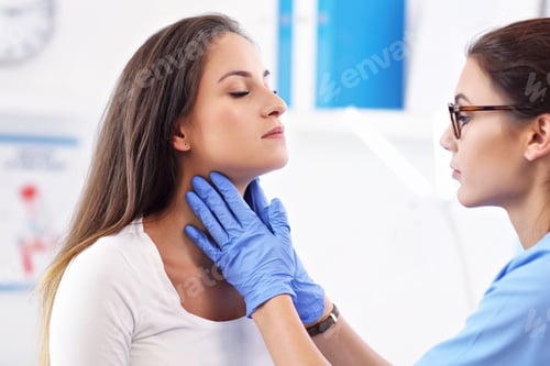 Preview: Adult woman having a visit at female doctor's office