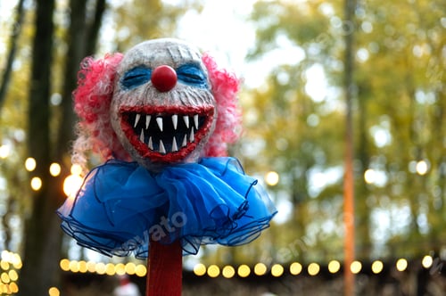 Preview: Funny colorful Halloween character face as a decoration in the Halloween party park