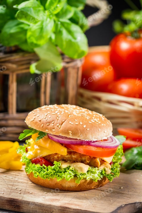 Preview: Closeup of a hamburger with chicken and fresh vegetables