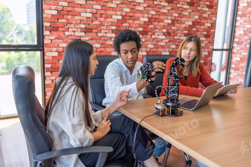 Preview: Teenager children learning with new innovation robotic hand interface hand control in classroom