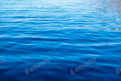Preview: Sea water surface calm with small ripples. Still ocean, deep blue color background,