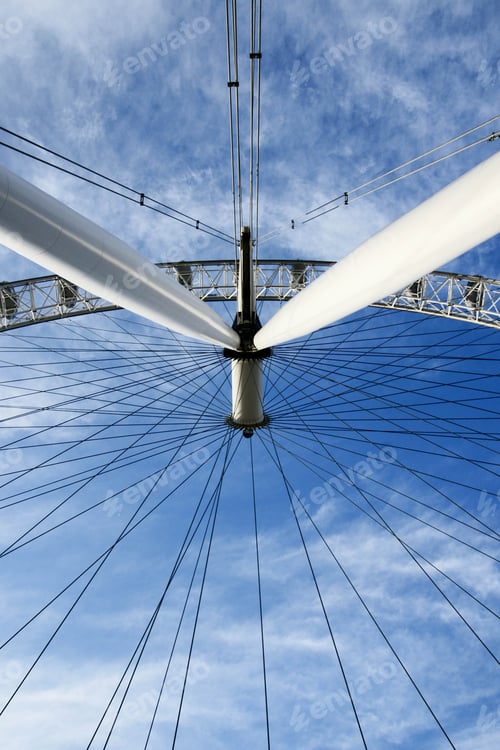 Preview: Low angle view of London eye against blue sky during sunny day