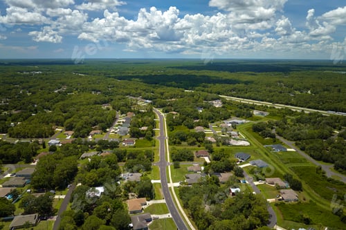 Preview: Aerial view of street traffic with driving cars in small town.
