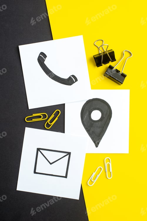Preview: Vertical view of drawings on white blanks on dark color yellow background with free space