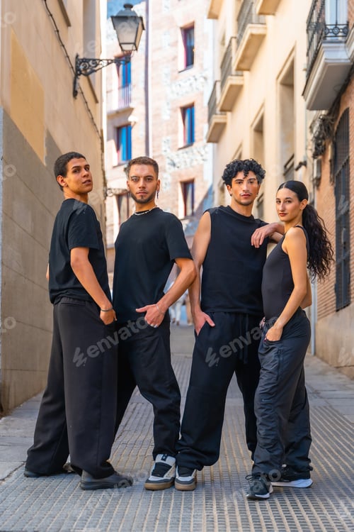 Preview: Young dancers posing on urban street in black clothing