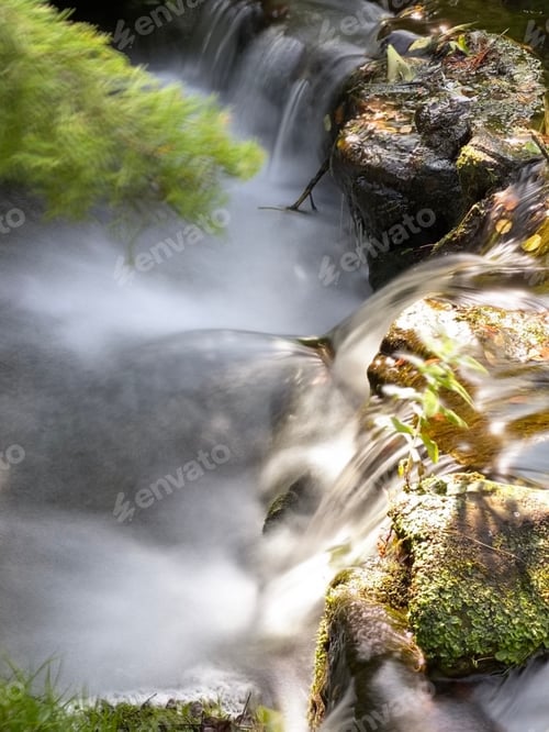 Preview: Water running over rock, slow motion, soft focus , light and airy