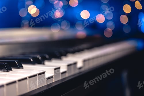 Preview: Piano keys close-up on a blurred background with bokeh.
