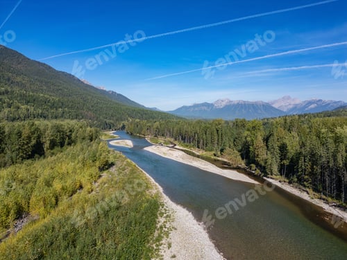 Preview: Scenic Aerial View of River and Mountains in Fernie, BC, Canada on a Clear Day