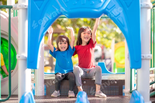 Preview: Child playing on the outdoor playground. Kids play in school or kindergarten yard.