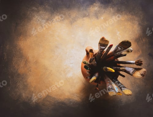 Preview: Paint brush in clay jug at art painting canvas as abstract background texture. Paintbrush painting