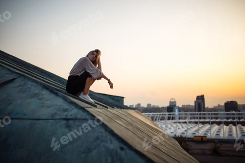 Preview: Young woman in roof enjoying sunset, freedom city atmosphere. People, lifestyle, relaxation concept.
