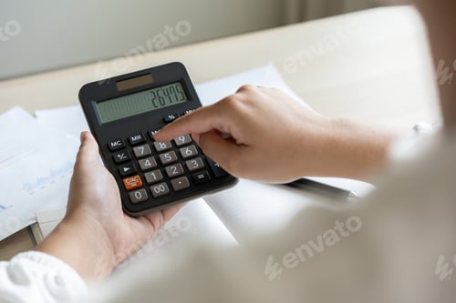 Preview: Woman calculate bill budget payment, home accounting concept with calculator.
