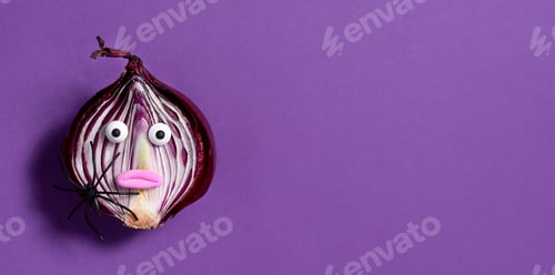 Preview: Halloween background. Spooky onion on a purple background. Halloween food. Banner.