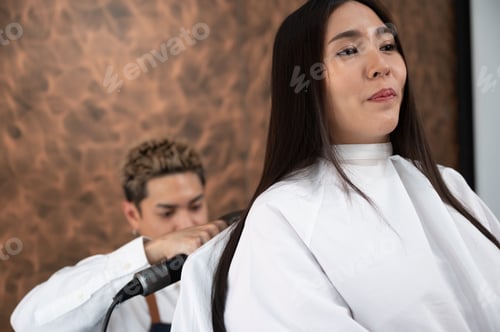 Preview: woman client person having a process to making treatment a hair with hairdresser in beauty salon