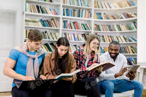 Preview: Ebook and digital gadgets vs traditional book. Joyful multiethnic students boys and girls, sitting