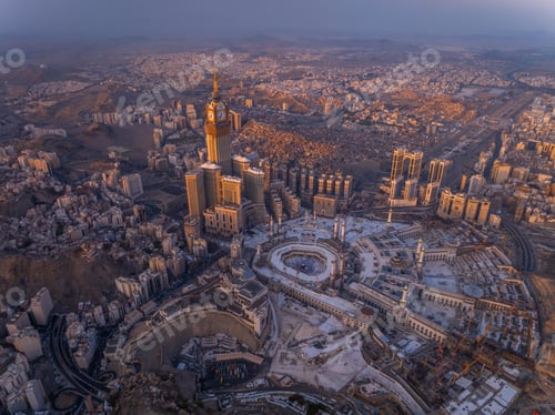 Preview: Aerial view of the Kaaba and Abraj Al-Bait Clock Tower in Mecca at sunrise