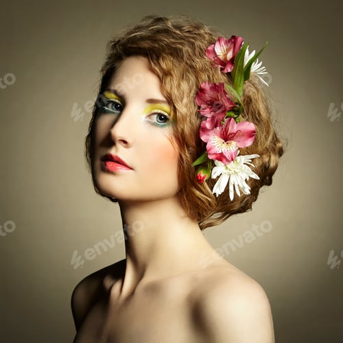 Preview: Beautiful young woman with delicate flowers in their hair