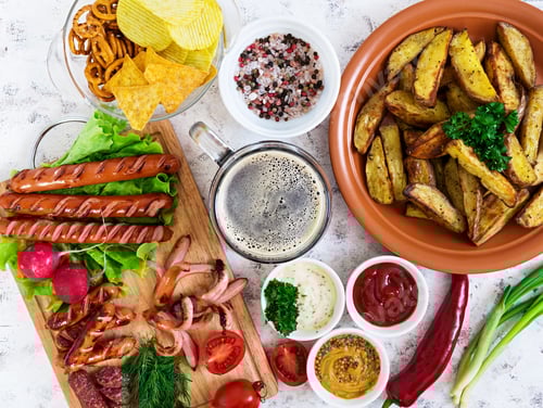 Preview: Baked potato wedges with sausages and spices. Top view