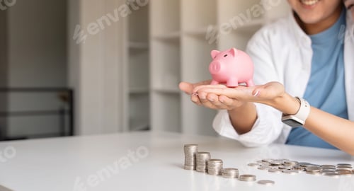 Preview: Saving money investment for future. Couple hands holding piggy bank with money . Couple asian